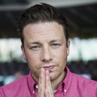 Jamie Oliver concerned but says he has “no sway” in Woolworths vegie dispute